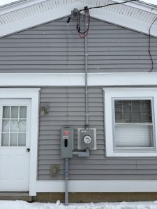 new 200 amp service line coming to the house and connected with a new meter and disconnect